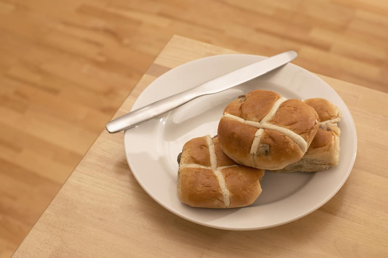 Hot cross buns on a plate