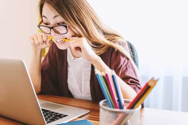 woman using laptop to work online