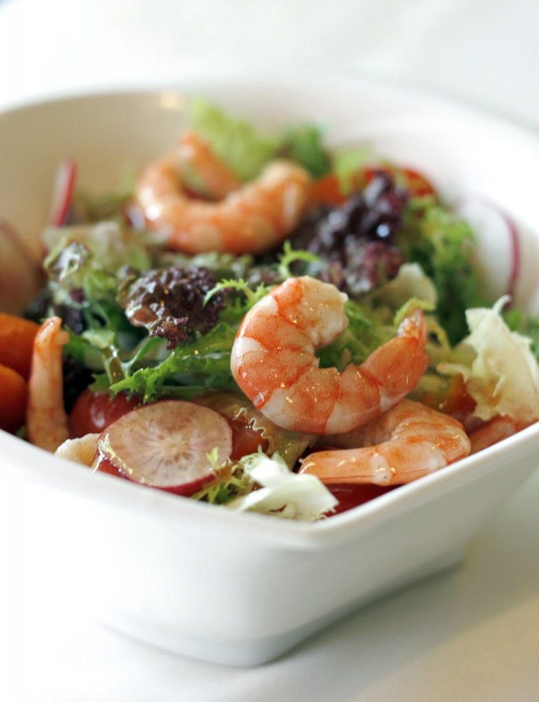 healthy salad with shrimp on top