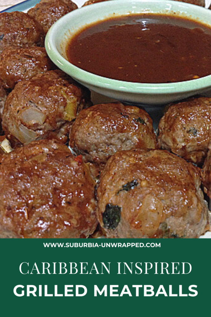 Caribbean meatballs on a plate with a bowl of jerk seasoning dipping sauce