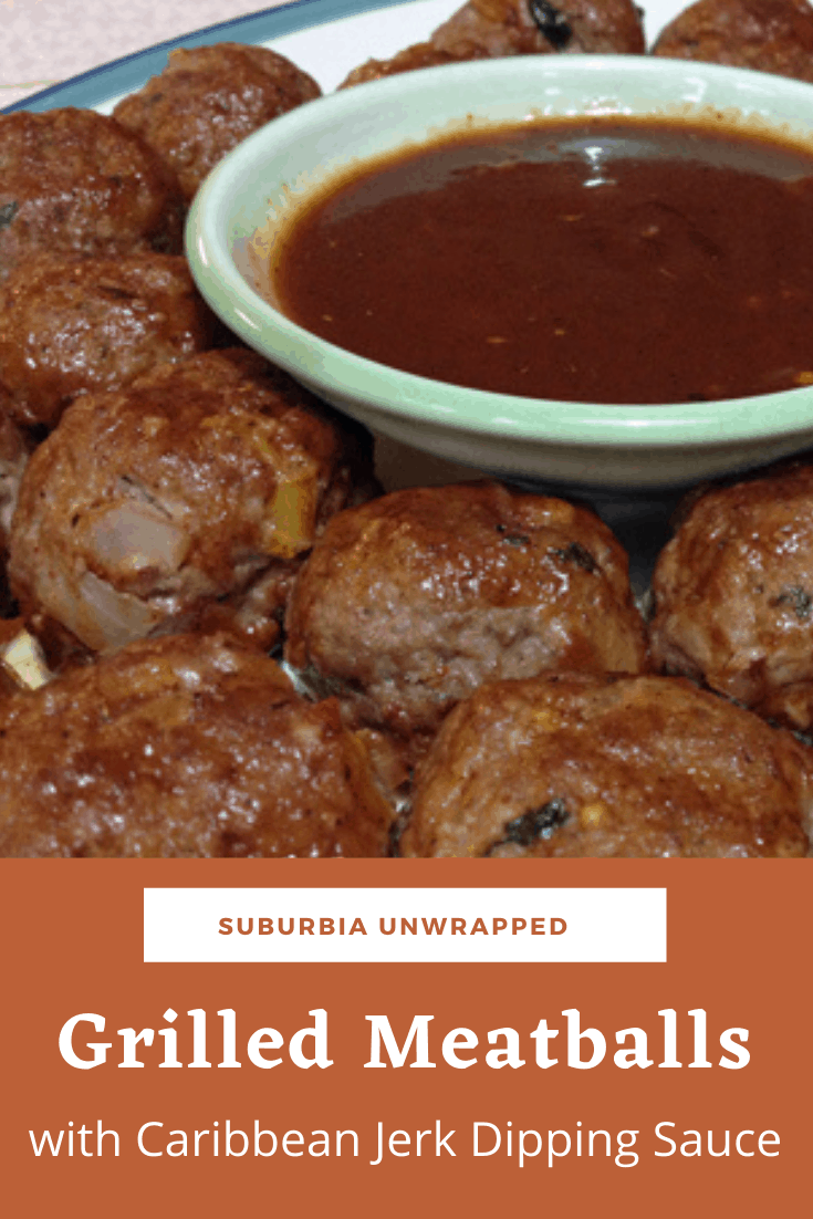 Grilled Meatballs on a plate with a bowl of Jerk Dipping Sauce