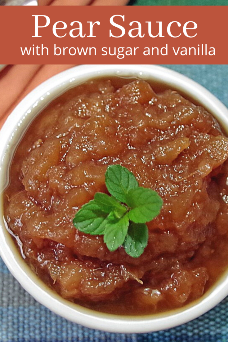 pear sauce in white bowl topped with a sprig of mint