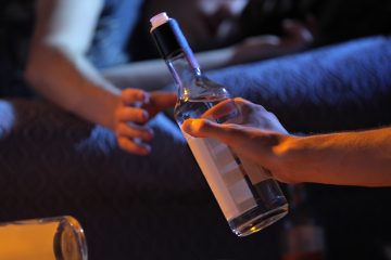 Two young men get drunk at home