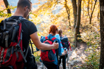 family hiking together in the woods with teenagers