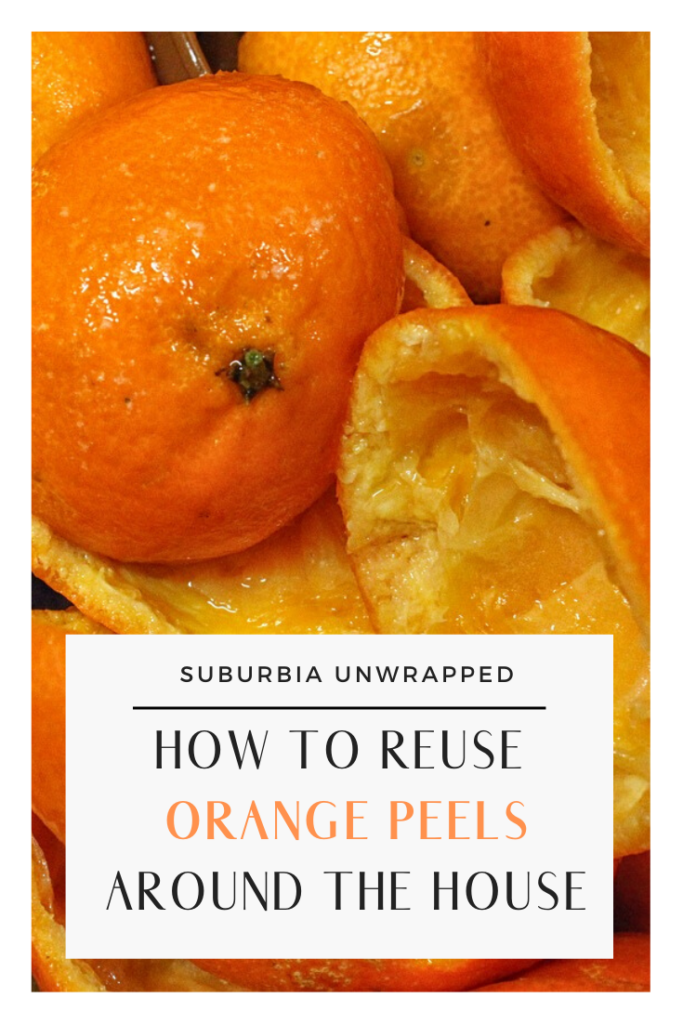 Leftover orange peels with text How to Reuse Orange Peels Around the House