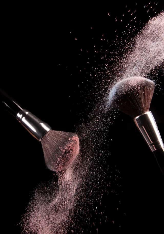 makeup brushes with powder on them