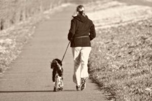 woman running with dog