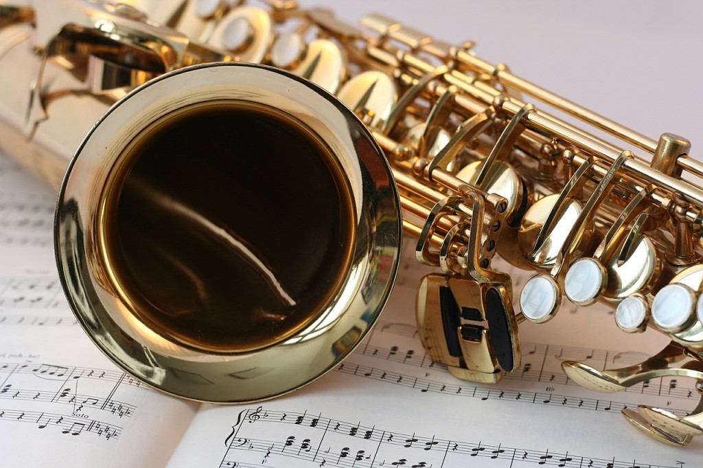 closeup of saxophone on sheet music