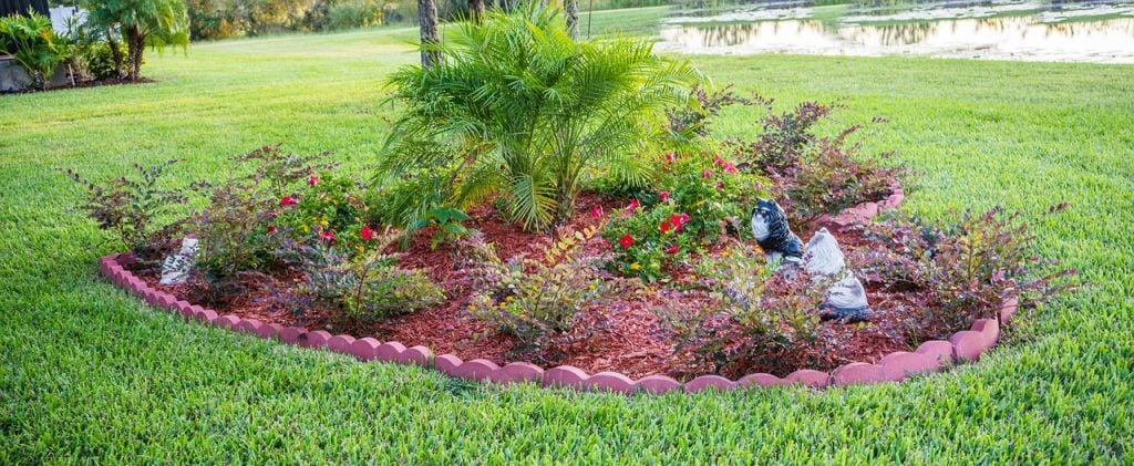 landscaped yard area with brick edging 