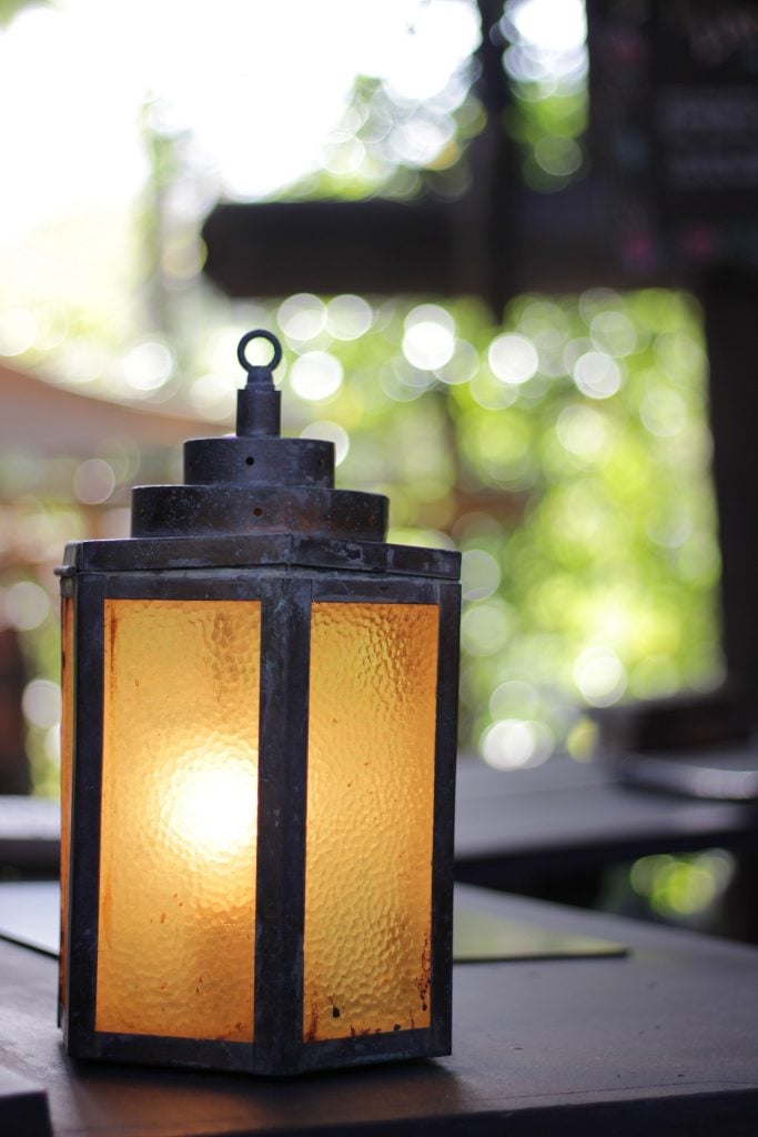 small lantern on a patio table