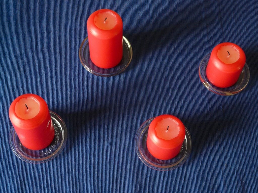 blue tablecloth with red candles