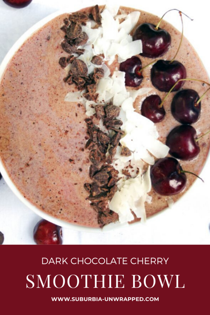 Dark Chocolate Cherry Smoothie Bowl on white background with fresh cherries next to it