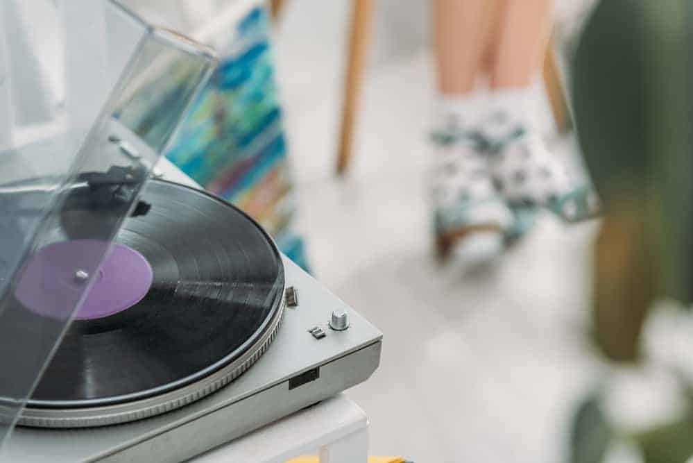 record player with girl in polka dot socks in background