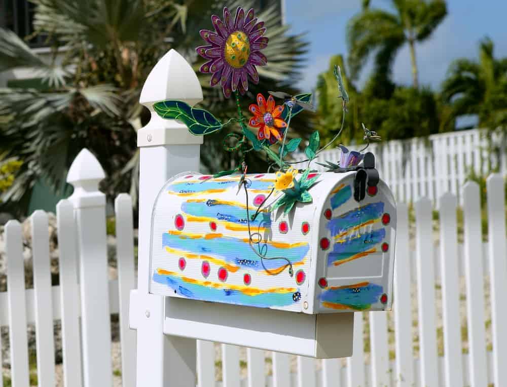 Fun artistic mail box with spring flowers decoration