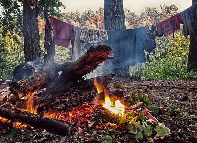 camping clothes by a campfire