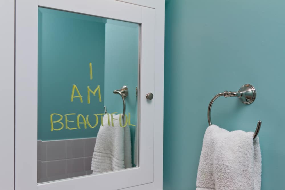 Positive body image in mirror