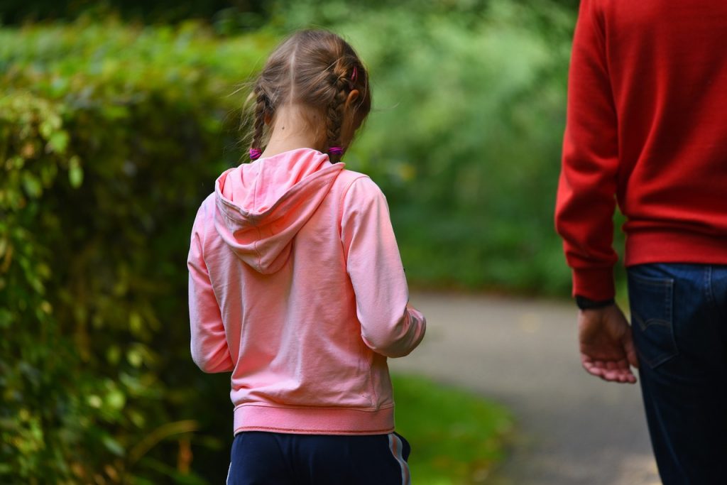 young girl with parent