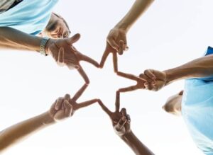 giving hands in the shape of a star