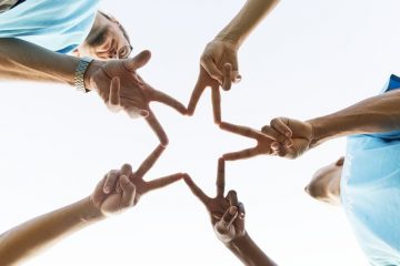 giving hands in the shape of a star