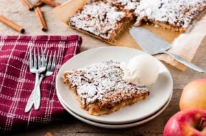grated apple tart on plate with icecream