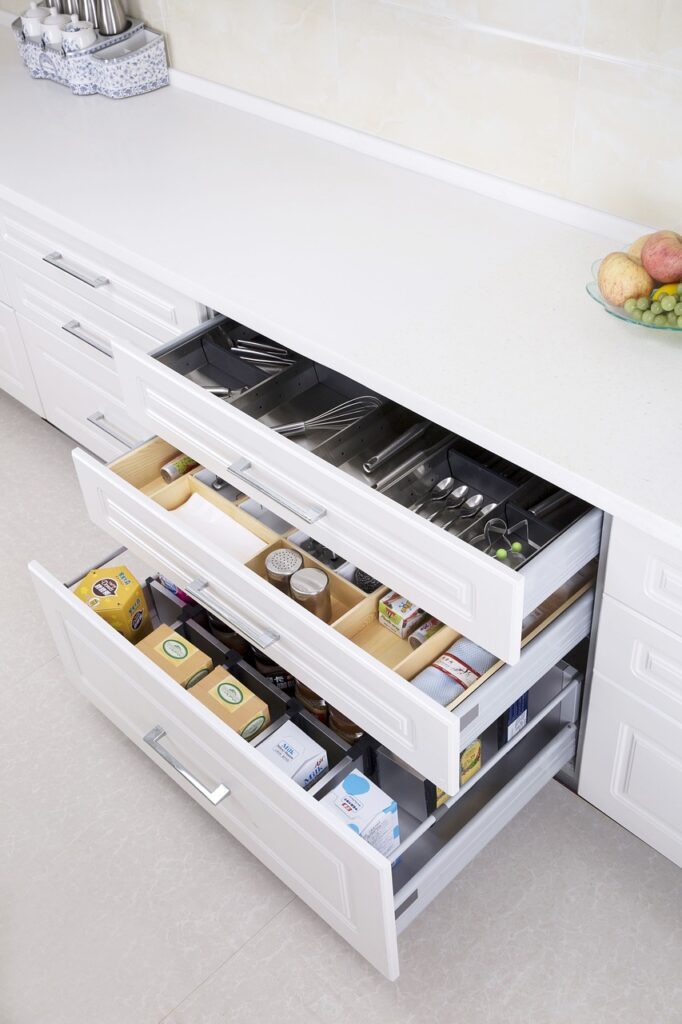 well organized kitchen drawers in white kitchen