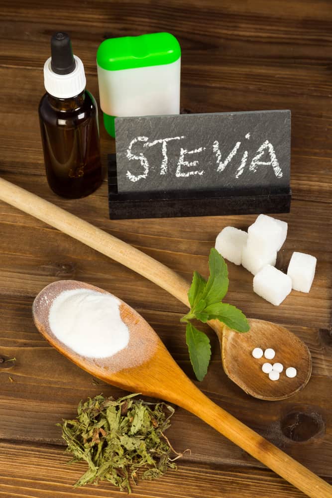 Healthy sweetener stevia in liquid tablet dried and powder forms, plus real sugar lumps