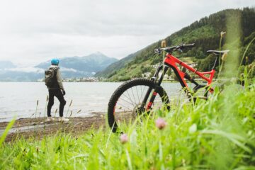 man and bicycle on beach for outdoor exercise