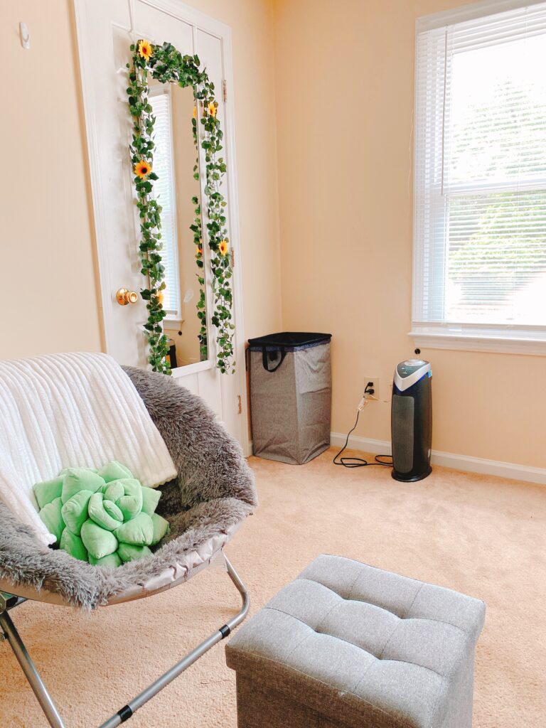 college apartment with chair and ottoman