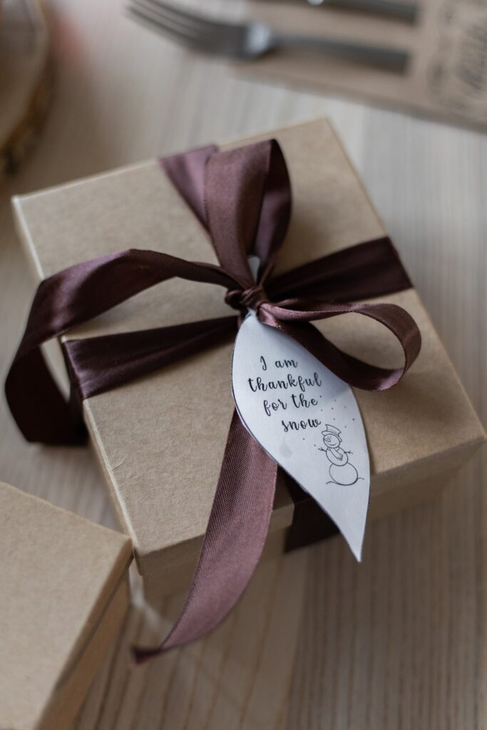 package wrapped with ribbon and tag