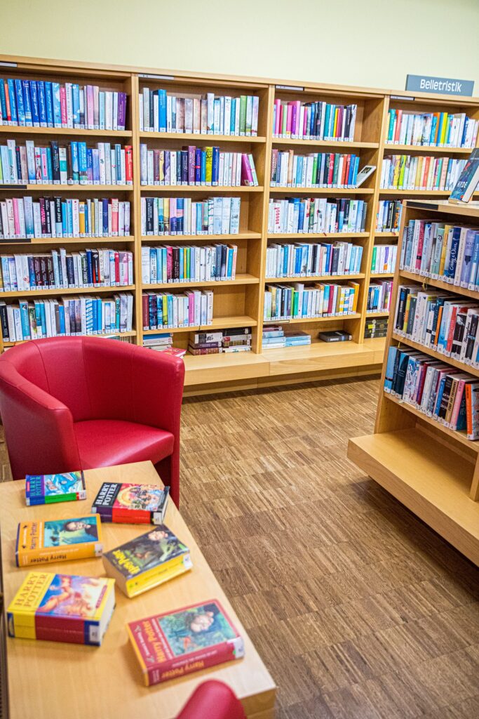 bookstore shelves and chair with table