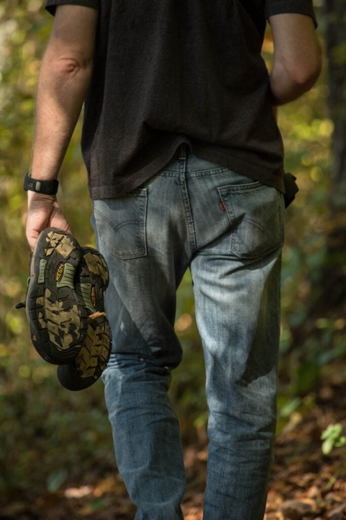 back view of man wearing brand name clothes