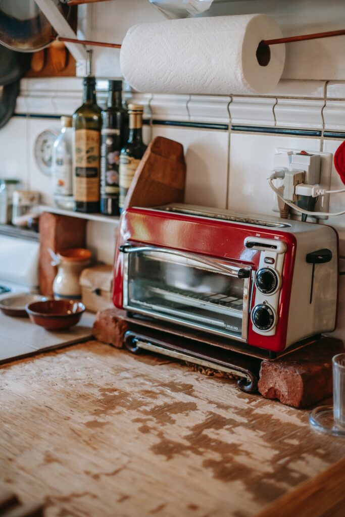 paper towel roll in a cluttered kitchen