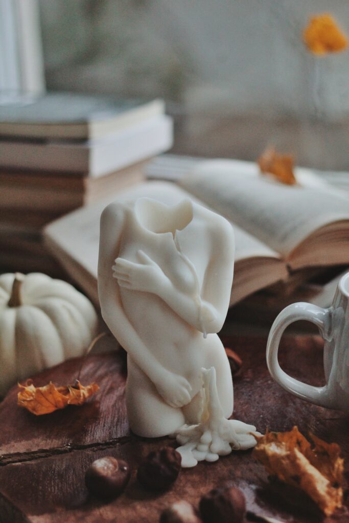 white figurine on a cluttered table